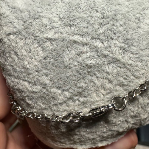 Silver 925 bracelet like new with dangling crosses, size 19