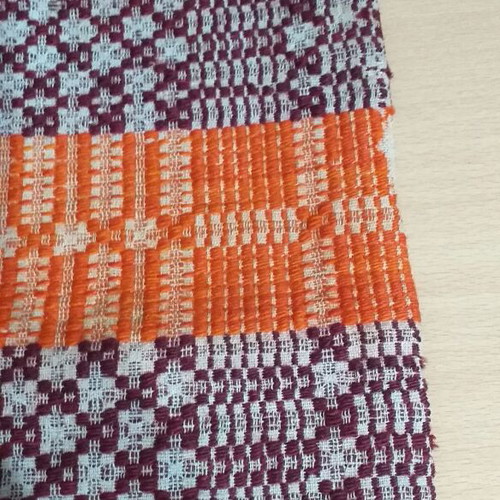 Old warp-weighted loom pillow used, very old with wear