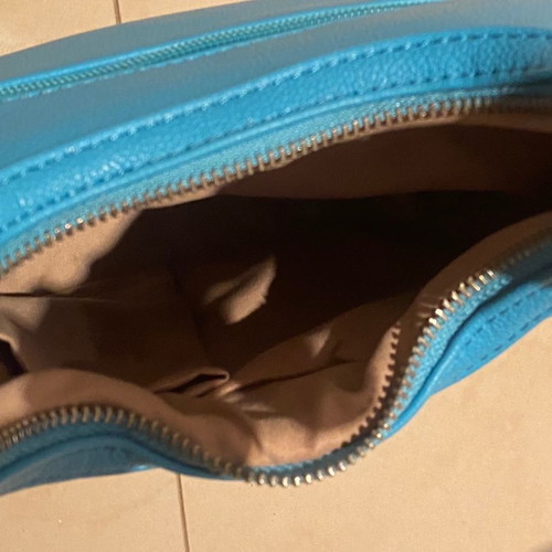 Blue leatherette shoulder bag with multiple compartments