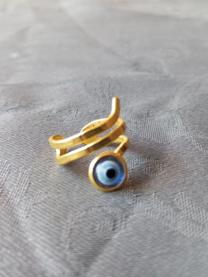Adjustable ring with eye, gold color, like new