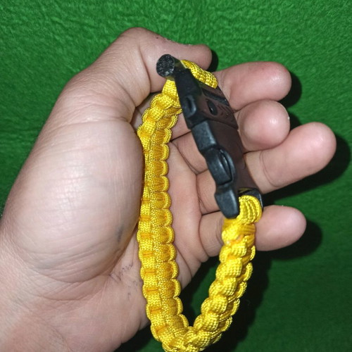 Paracord bracelet survival with cord, whistle and fire starter