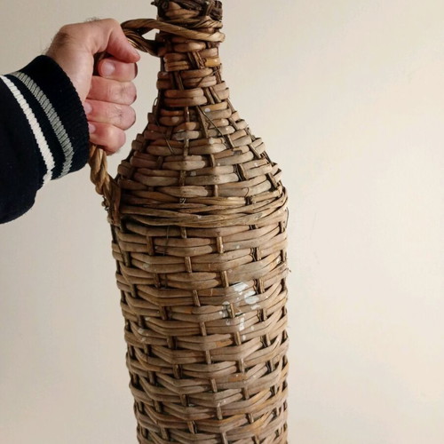 Demijohn with woven cover used