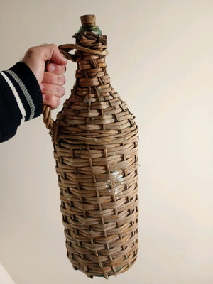 Demijohn with woven cover used