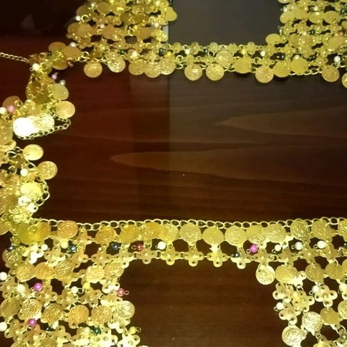Genuine Khanoumisa belt like new, adjustable, gold-colored