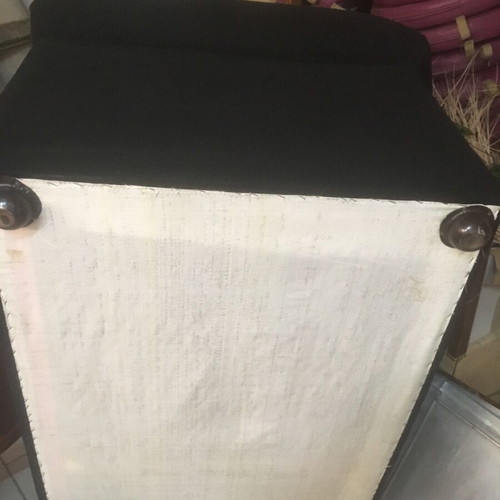 Two-seater black sofa used with wooden legs and washable fabric