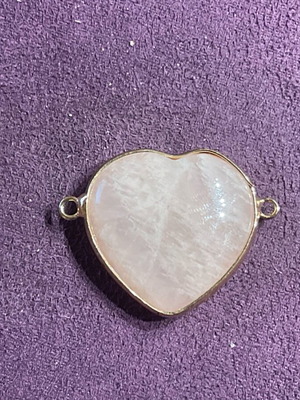 Rose quartz stone pendant with heart shape