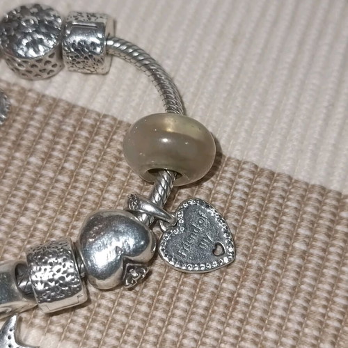 Pandora silver bracelet with 11 charms and collectible clasp, like new