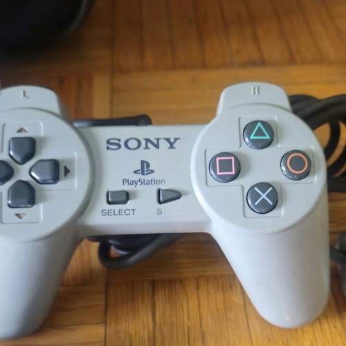 Sony PS One Slim console bundle with 2 controllers, official bag & 4 games
