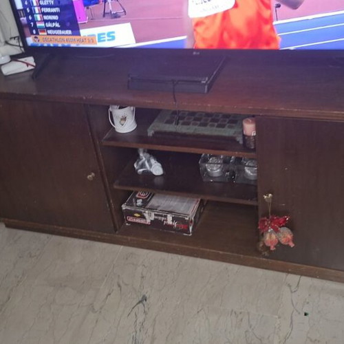 TV stand used with two closed cabinets