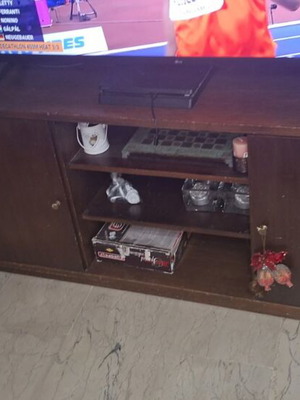 TV stand used with two closed cabinets
