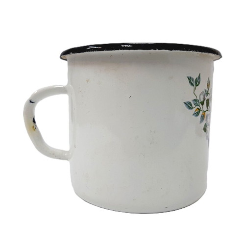 Vintage enamel metal mug with floral motif