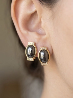Gold tone clip-on earrings with black stone