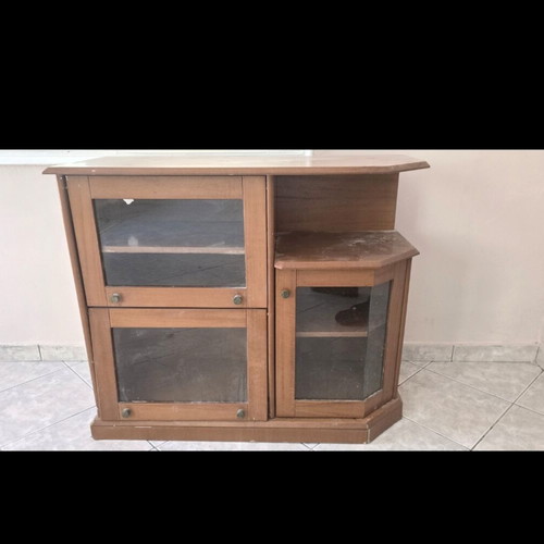 Wooden TV unit with glass doors used, storage space