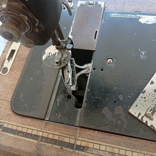 Manual tabletop sewing machine, 100-year-old German