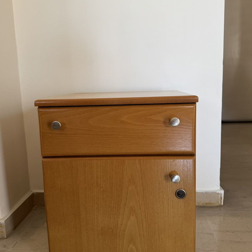 Wooden nightstand used with drawer and lockable cabinet