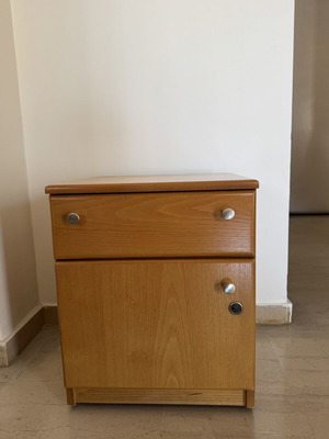 Wooden nightstand used with drawer and lockable cabinet