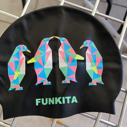 Three branded swimming caps