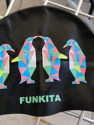 Three branded swimming caps