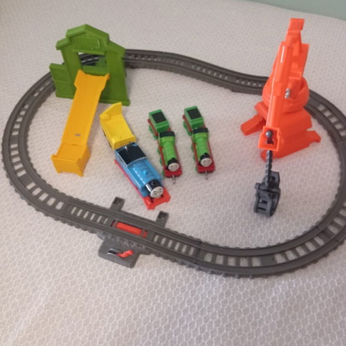 Thomas The Tank Engine train set like new with tracks, three trains, crane, and slide