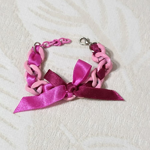 Pink bracelet with chain and bow, new