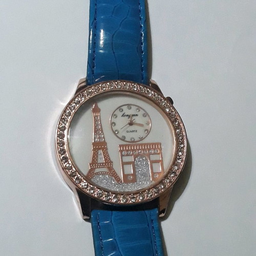 Women's wristwatch with rhinestones and blue straps used