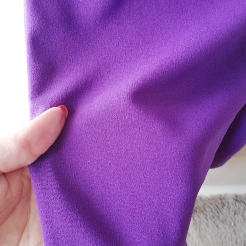 Jumpsuit with V neckline and ruffles, purple, size small, like new