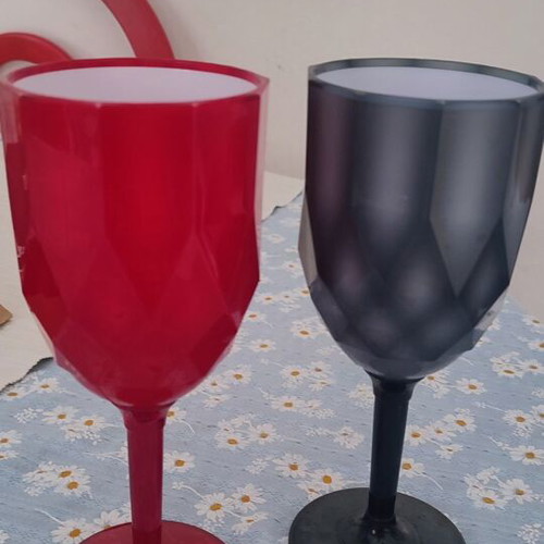 Plastic cups two, red and black, used