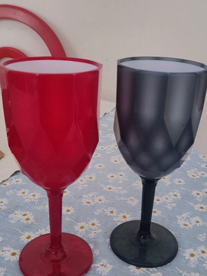 Plastic cups two, red and black, used