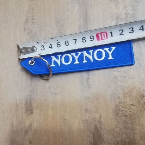 Nounou keychain new, blue with white letters