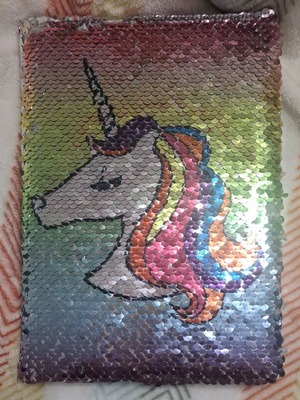 Double-sided unicorn sequin notebook used without first page
