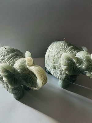 Carved elephant-shaped candles set of 2 like new, blue shades