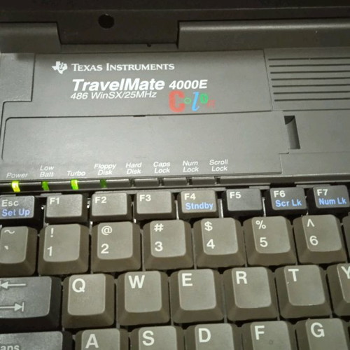 Texas Instruments vintage laptop used, 1980s with charger and mouse
