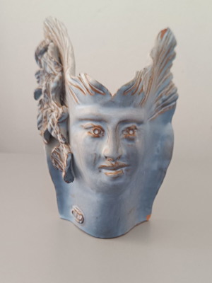 Vintage ceramic tabletop sculpture with ancient Greek relief leaves used
