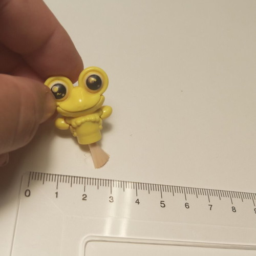 Plastic frog toy with brush like new