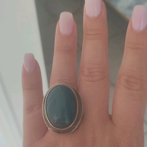 Silver large ring with petrol oval stone used