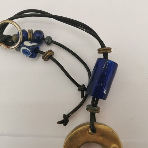 Bronze horseshoe charm used with small glass bead