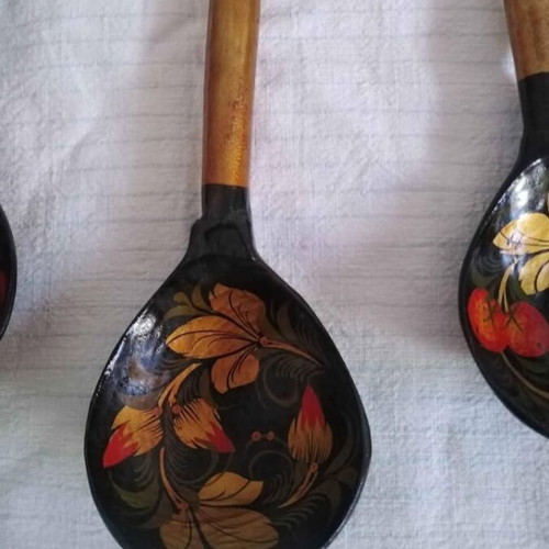 Set of three handmade wooden Russian spoons used, hand-painted