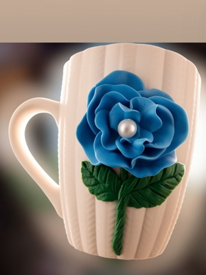 Handmade polymer clay mug with flower design