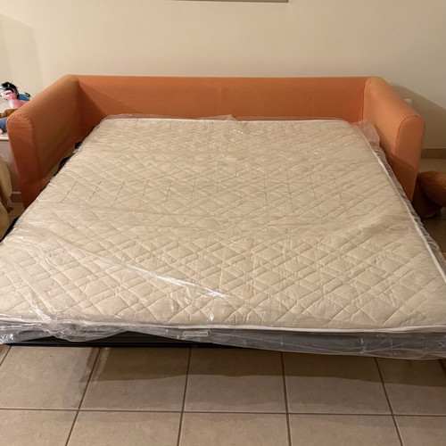 Sofa bed SATO used with two decorative pillows and throw