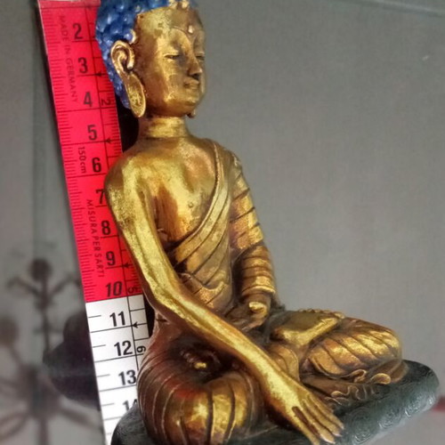 Golden ceramic Buddha statue sitting meditation decoration