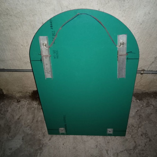 Semi-circular bathroom mirror used with 2 lights and shelf