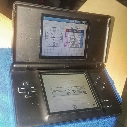 Nintendo DS Lite used with Dialga and Palkia reshell, charger, stylus, and carrying case