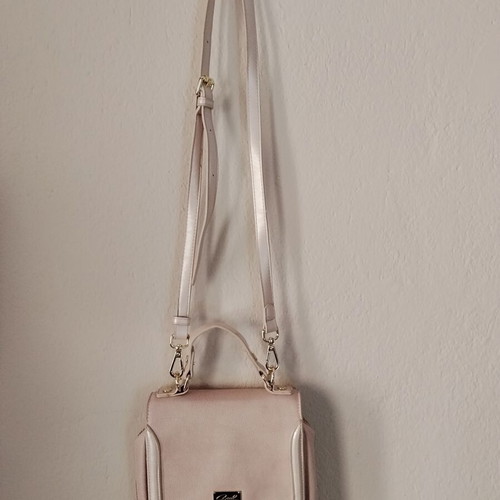 Axel pink shoulder bag used with gold details