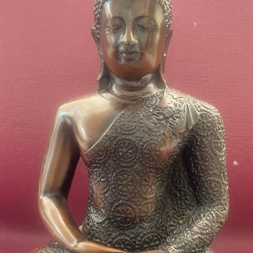 Thai Buddha statue with detailed embossed decoration