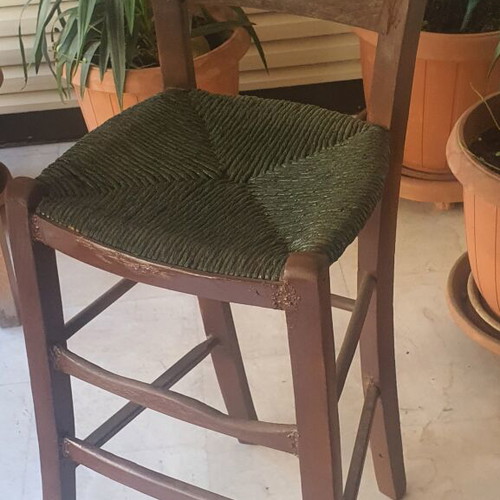 Wooden high chair with woven seat
