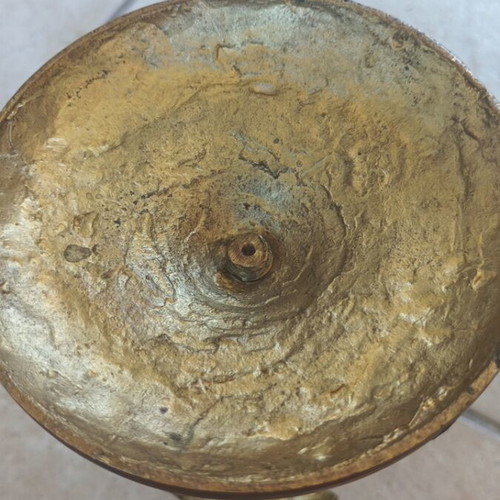 Metal candlestick used, gold color with brass finish