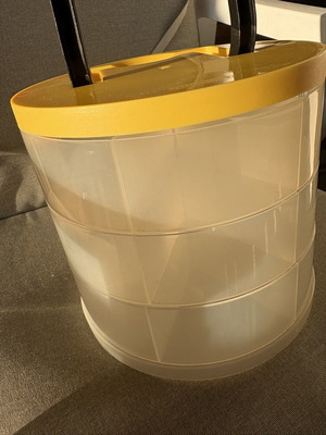 Plastic cylindrical multipurpose box used for sewing, beads, office organization