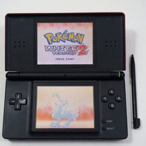 Nintendo DS Lite console used with Pokemon LeafGreen cartridge and accessories