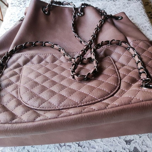 Backpack like new with quilted texture and handles