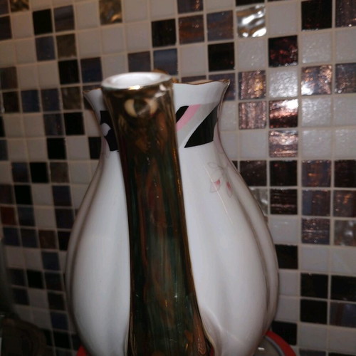 Vintage teapot used with gold details, missing lid